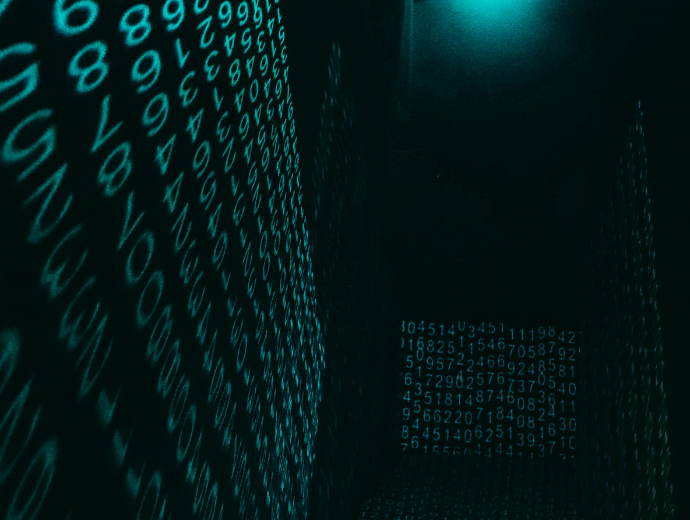 Green code of letters projected on to a wall